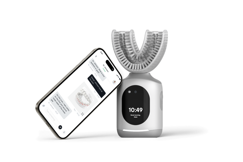 Feno smart U-shaped toothbrush displayed with a smartphone app, highlighting its timer and connected brushing technology