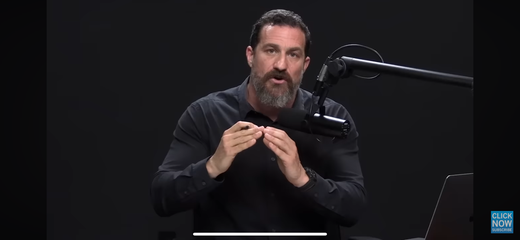 Podcast host speaks into a studio microphone while explaining the dangers of mouth breathing.