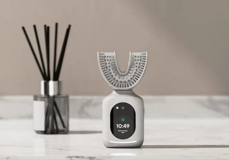 Advanced oral care device on a bathroom counter with a sleek digital display