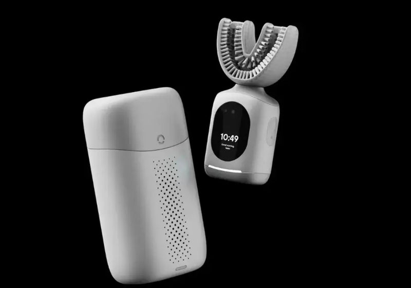 New dental technology pairing smart toothbrush with sleek portable charging and sanitizing case.