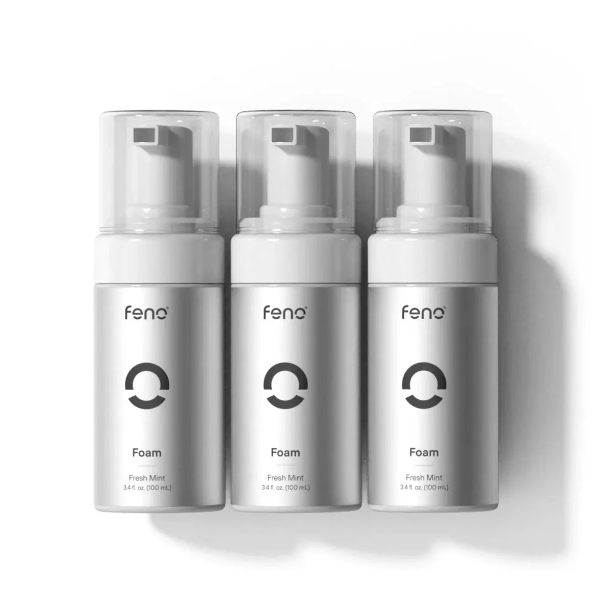 Three 3.4 fl oz bottles of Feno Foam fresh mint foaming toothpaste on a white background