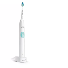 Electric toothbrush with a sleek white design, compact charging base, & a blue-bristled brush head